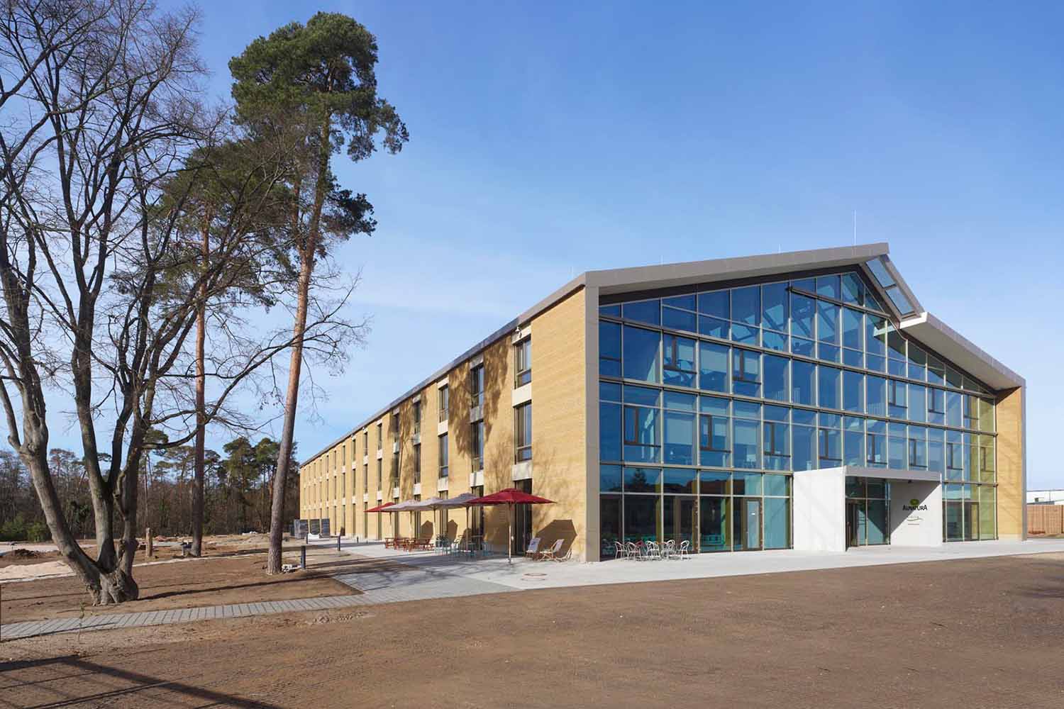 Exterior view of the Alnatura Campus in Darmstadt made of rammed earth segments